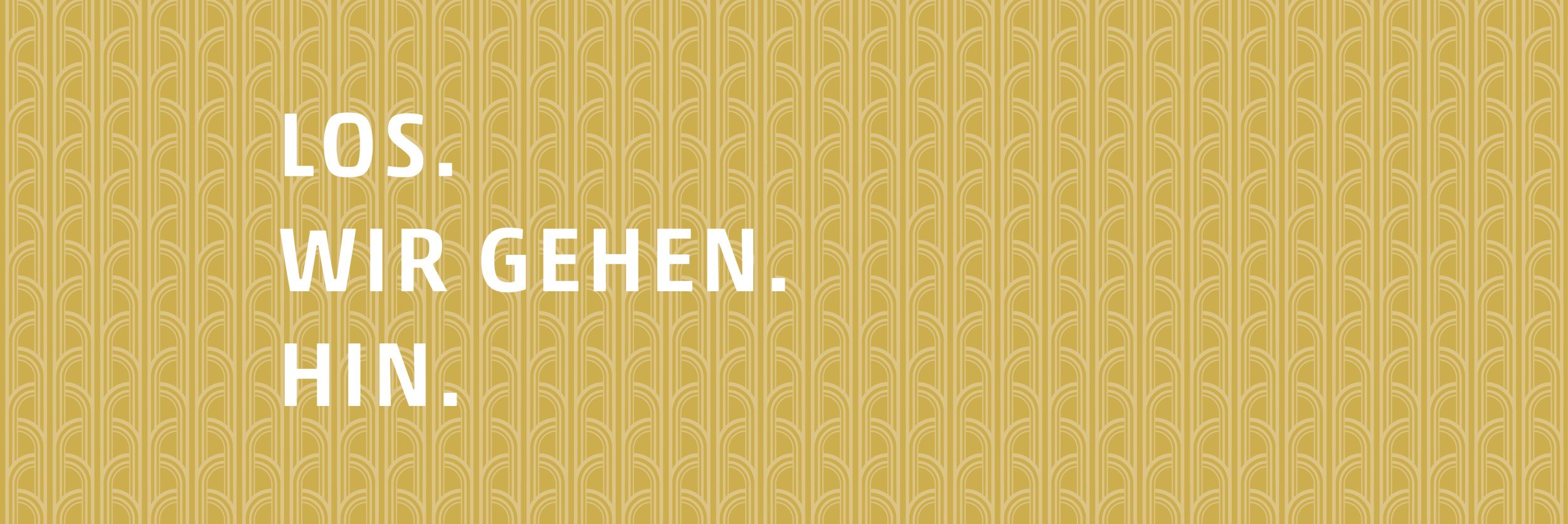 Zu sehen ist ein goldenes Muster, auf dem in weißen Buchstaben die Worte &quot;Los. Wir gehen. Hin.&quot; stehen., © Stadt Bad Salzuflen